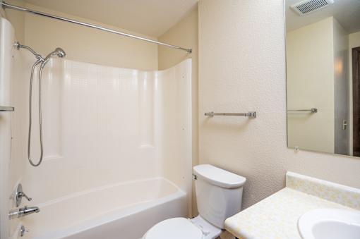 a bathroom with a bathtub and a sink