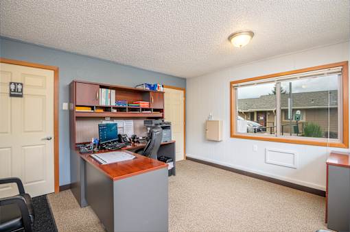 A room with a desk and a chair.