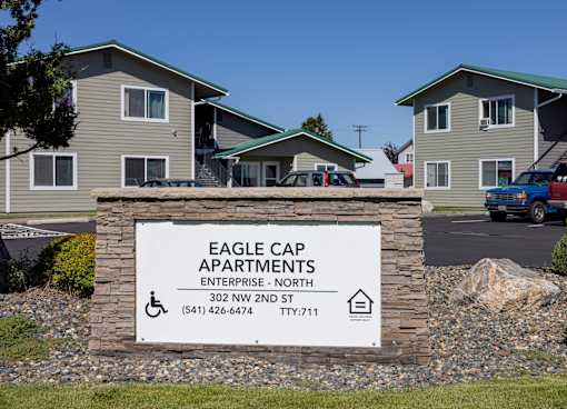 a building with a sign for eagle gap apartments