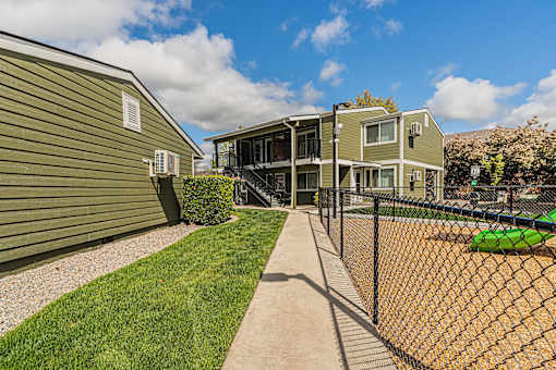 the yards are fenced in with a chain link fence