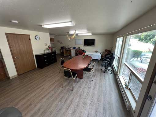 a view of the dining room and living room from the balcony
