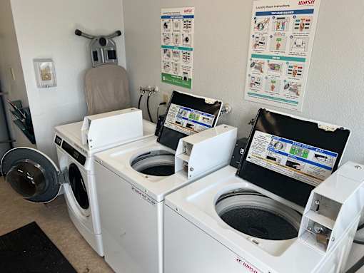 A washing machine with a screen on the door.