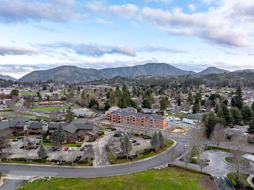 A mountainous landscape with a town in the foreground.