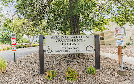a sign for spring garden apartmentstalent