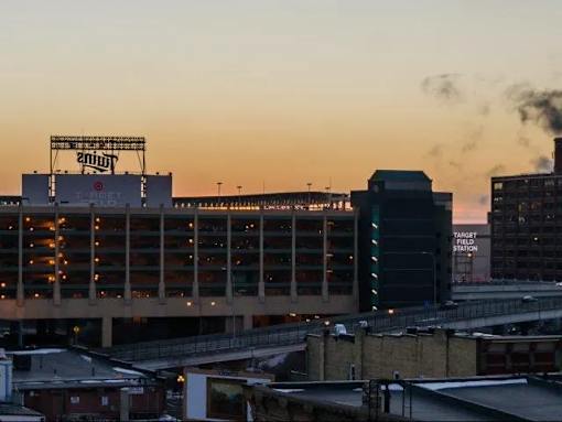 a city skyline with a large building in the middle