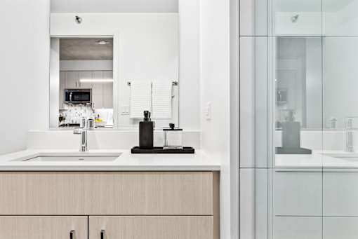 a kitchen with a sink and a glass door