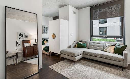 a living room with a couch and a large window