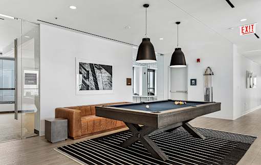 a pool table in the living room of a house