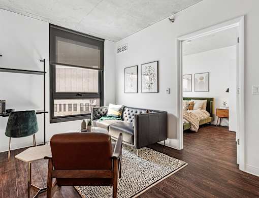 a living room with a couch and a chair