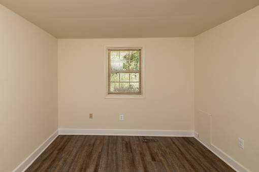 A room with a window and wooden flooring at The Orchards at Severn Townhomes*, Severn, MD 21144