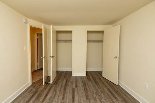 A room with a wooden floor and white walls.at Severn Townhomes*, Severn, MD 21144