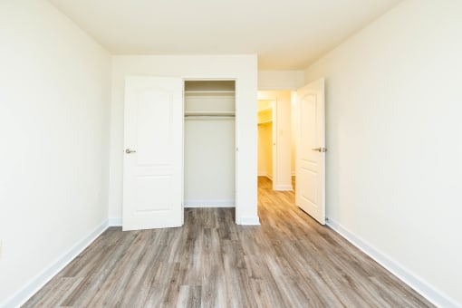 a bedroom with white walls at Seminary Roundtop Apartments, Lutherville, Maryland, 21093