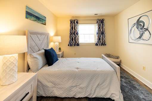 Second bedroom with a bed and window