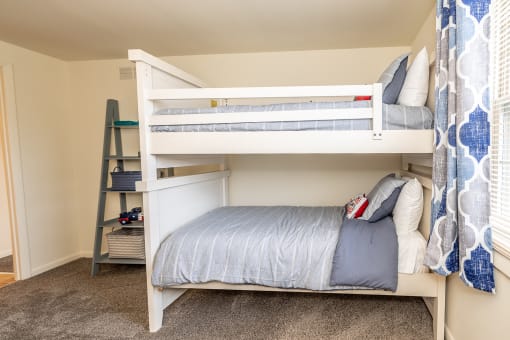 Two bunk beds in a bedroom at Chapel Valley Townhomes, Baltimore, 21236