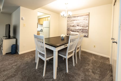 a dining room with a table and chairs at Chapel Valley Townhomes, Maryland