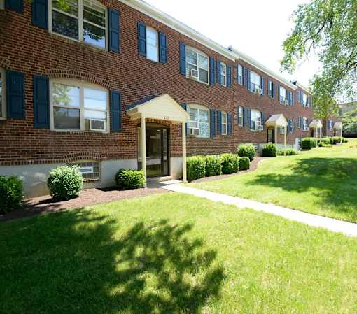 A building with a white entrance at Loch Bend Apartments, Baltimore, MD, 21234