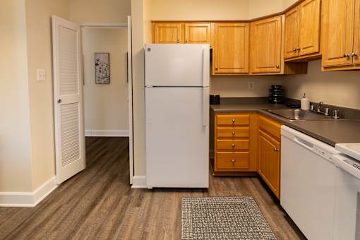 A kitchen with white appliances