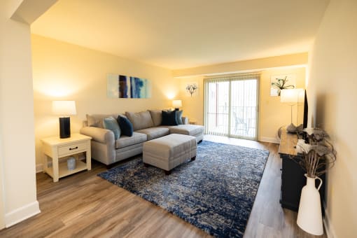 Living room with a couch at Rockdale Gardens Apartments*, Baltimore.
