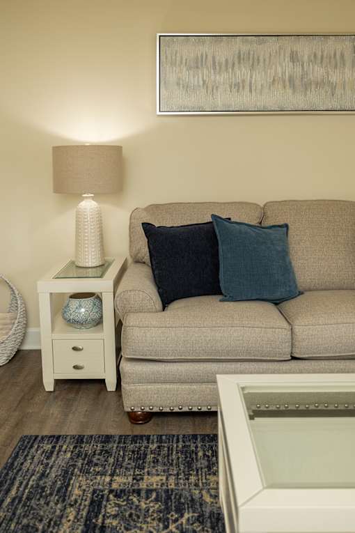 A Living Room with a couch at The Brittany Apartments, Pikesville, Maryland