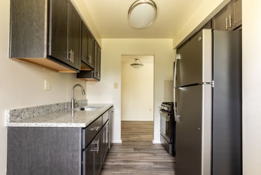 Kitchen with black appliances at Seminary Roundtop Apartments, Lutherville, Maryland