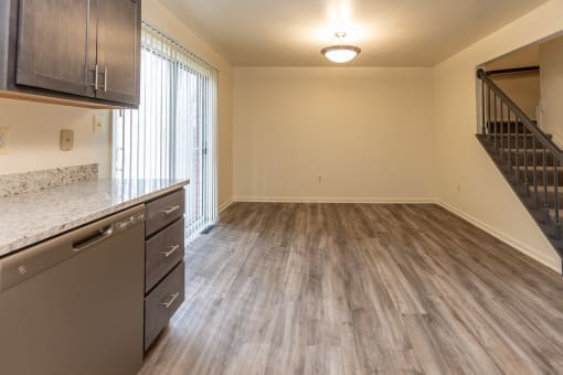 a kitchen and living room in an empty apartment at Carlson Woods Townhomes, Maryland