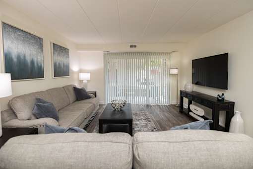 Living room with a couch and a tv at Ivy Hall Apartments*, Towson, MD 21204