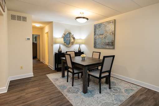 Dining room with a wooden table and chairs at Ivy Hall Apartments*, Towson