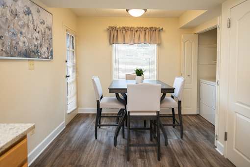 View of an eat-in kitchen with a table and chairs at Ivy Hall Apartments*, Towson, MD