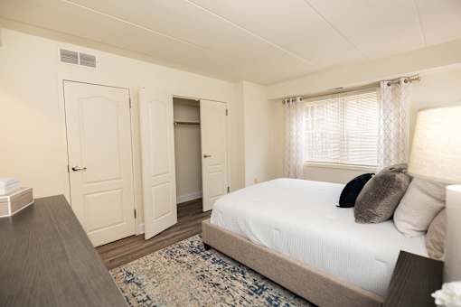 Bedroom with a bed at Ivy Hall Apartments*, Towson, MD 21204.