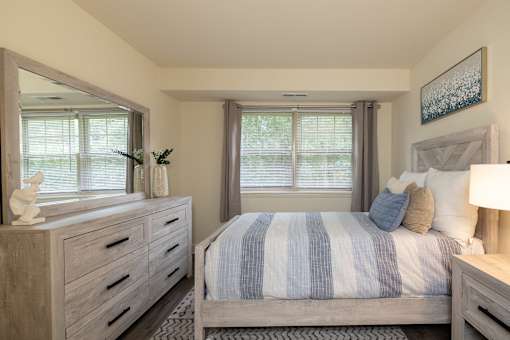 Second bedroom with bed, nightstand, and window  at Village of Pine Run Apartments & Townhomes*, Maryland, 21244