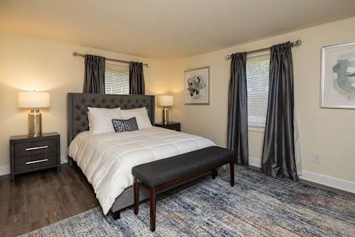 A bedroom with bed and windows at Spring Hill Apartments & Townhomes, Baltimore, MD 21234