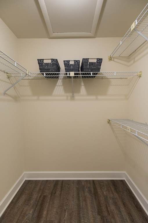 Empty shelves in a walk-in closet. Spring Hill Apartments & Townhomes, Baltimore, MD 21234