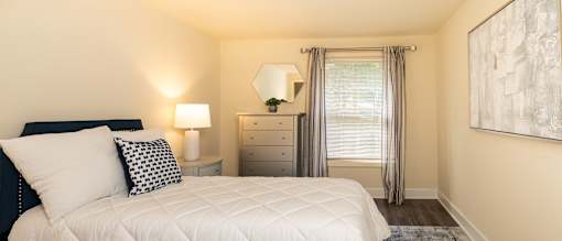 A bedroom with bed and windows at Spring Hill Apartments & Townhomes, Baltimore, MD 21234