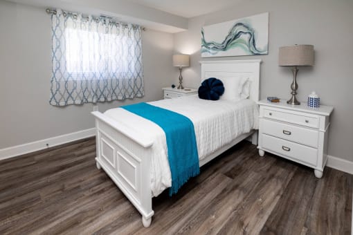 A bedroom with a bed and two night stands  at Fairbrook Park, Baltimore, MD 21244