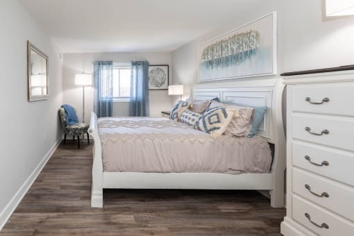 a bedroom with a bed and dresser at Fairbrook Park, Maryland