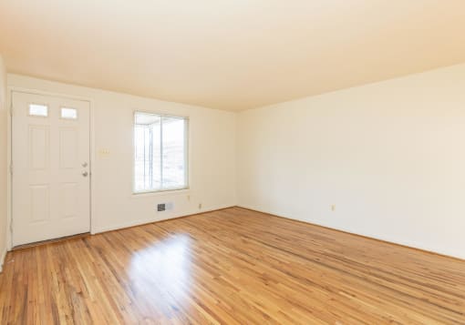 Well lit living room at Foxridge Townhomes, Baltimore, MD 21221