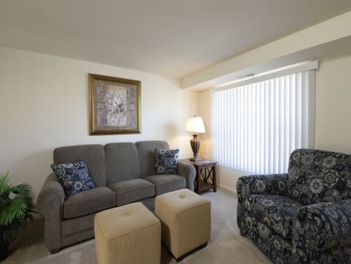 Living room with a couch and two chairs at Yorktowne Townhomes Apartments, Pennsylvania, 17331