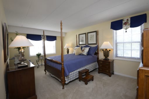 Bedroom with a bed in a room at Ivy Hall Apartments*, Towson