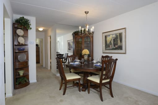 Dining room with a wooden table and chairs at Ivy Hall Apartments*, Maryland, 21204