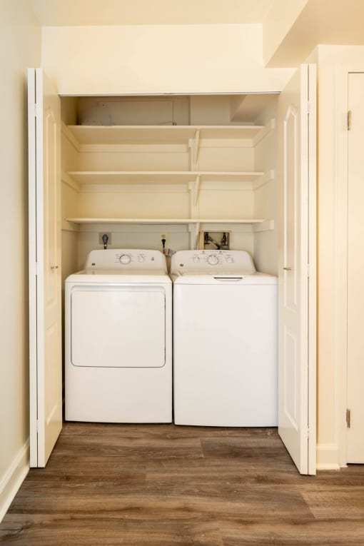 Small laundry room with a washer and dryer at Ivy Hall Apartments*, Towson