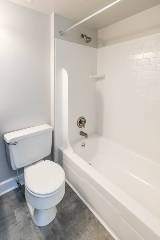 Bathroom with a toilet and a bathtub at McDonogh Village Apartments & Townhomes, Randallstown, 21133
