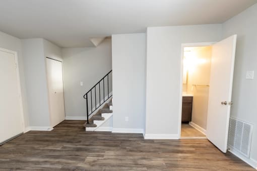 A bedroom with a staircase in a 555 waverly unit at McDonogh Village Apartments & Townhomes, Randallstown, Maryland, 21133