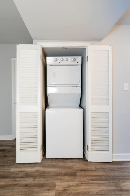 Utility room with a washer and dryer in a 555 waverly unit at McDonogh Village Apartments & Townhomes, Randallstown, Maryland