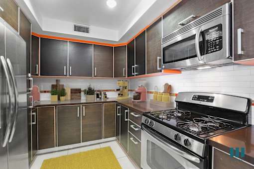 Full-Size Kitchen with Energy-Effcient Appliances and Ample Cabinet Storage