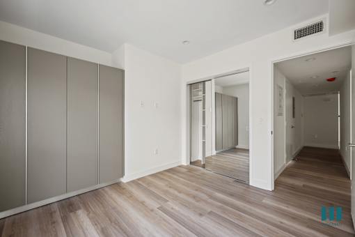 a renovated apartment with white walls and wood floors