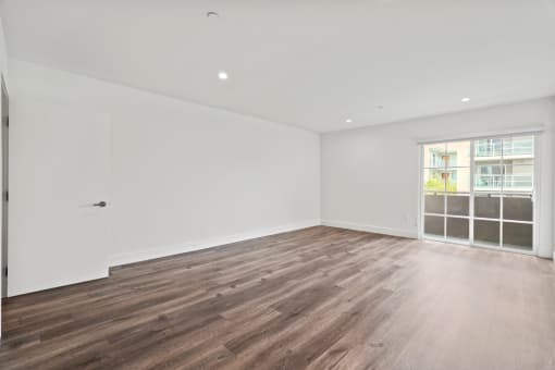 Spacious Living Room with Recessed Lighting, Vinyl Flooring, and Balcony