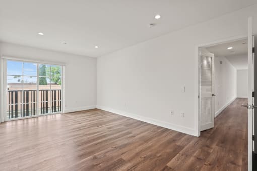 Living Room with Recessed Lighting, Vinyl Flooring, and Balcony