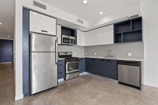 Kitchen with Stainless Refrigerator, Stove, and Microwave Oven