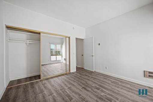 A room with a sliding door and a window.
