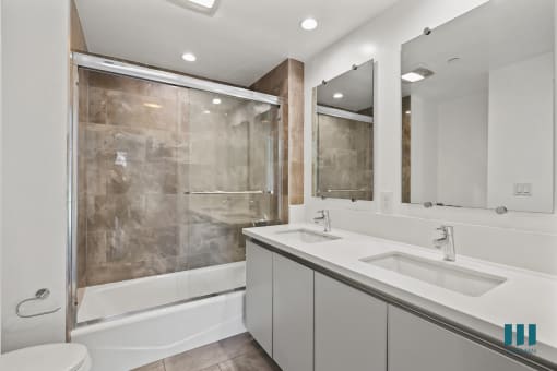 Bathroom with Shower Bath with Glass Door, Double-Sink Vanity with Cabinet Storage